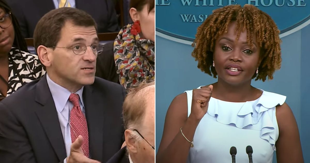 A member of the White House press corps, left, asks a question of White House press secretary Karine Jean-Pierre, right.