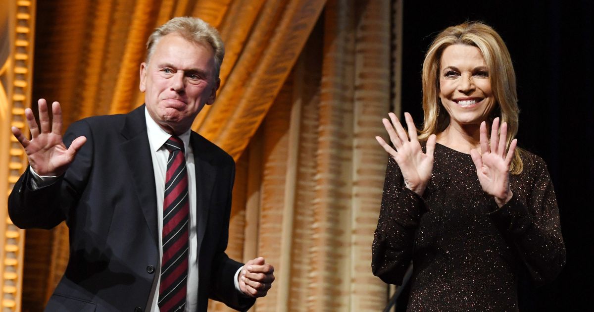 "Wheel of Fortune" host Pat Sajak and sidekick Vanna White walk onstage as they are inducted into the National Association of Broadcasters' Broadcasting Hall of Fame at Encore Las Vegas on April 9, 2018.
