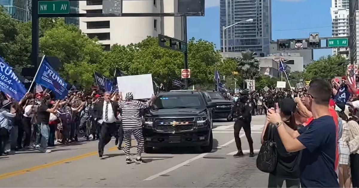 Anti-Trump protester pays the price for rushing motorcade outside courthouse.