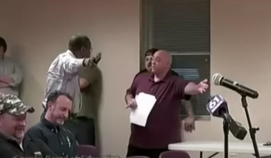 After elementary students at Wells Road Intermediate School in Granby, Connecticut, were shown a "pride" month video, several parents, including the man in maroon, voiced their displeasure at a school board meeting on Wednesday.