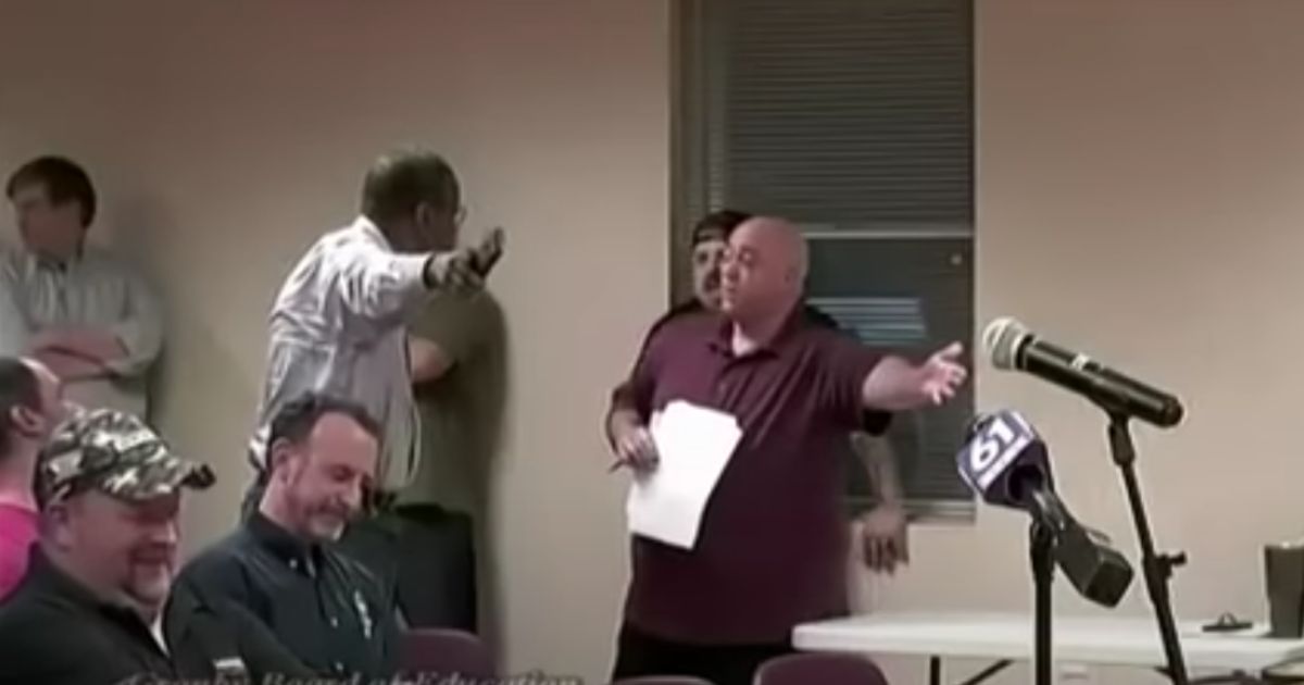 After elementary students at Wells Road Intermediate School in Granby, Connecticut, were shown a "pride" month video, several parents, including the man in maroon, voiced their displeasure at a school board meeting on Wednesday.