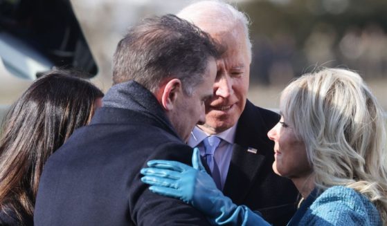President Joe Biden embraces his family after he was sworn in as the 46th President of the United States during his inauguration on the West Front of the U.S. Capitol in Washington, D.C., on Jan. 20, 2021.