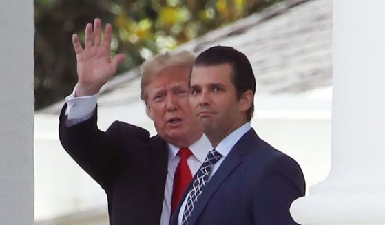 Then-President Donald Trump and his son Donald Trump Jr. are seen at the White House in a file photo from 2018.