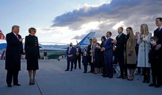 Then-President Donald Trump and first lady Melania are greeted by his children -- Tiffany Trump, Donald Trump Jr., Eric Trump and Ivanka Trump -- and other family members on the tarmac at Joint Base Andrews in Maryland on Jan. 20, 2021, his last day in office.