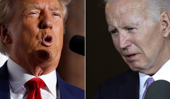 Fox News said it took down and "addressed" a caption that labeled President Joe Biden, right, a "wannabe dictator" who had "his political rival," Donald Trump, arrested.