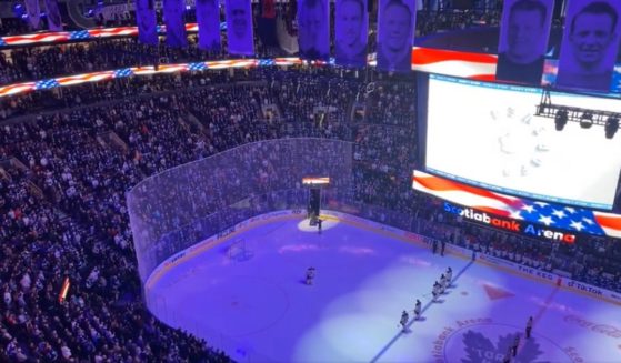 The crowd at a game for the Toronto Maple Leafs sing "The Star Spangled Banner" at Scotiabank Arena in Toronto, on March 13.