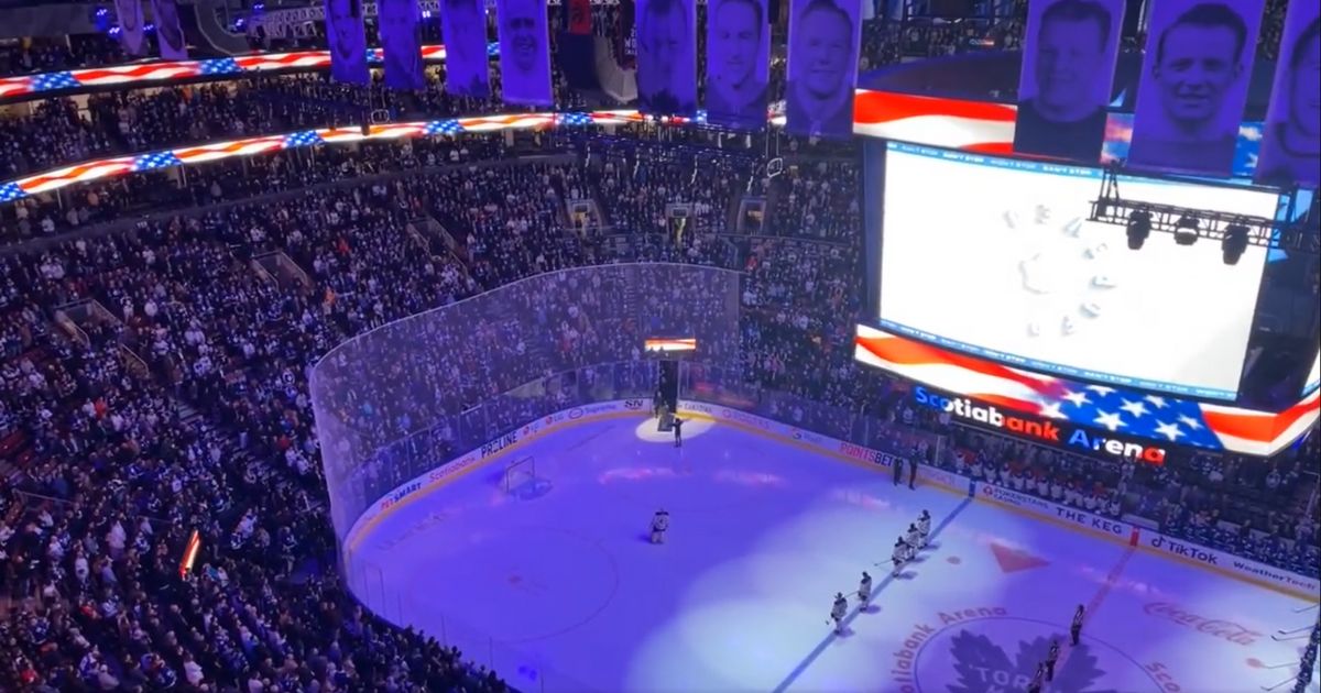 The crowd at a game for the Toronto Maple Leafs sing "The Star Spangled Banner" at Scotiabank Arena in Toronto, on March 13.
