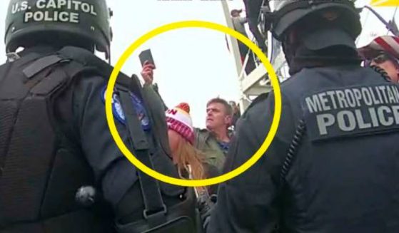 This image from Washington Metropolitan Police Department body-worn video, released and annotated by the U.S. Department of Justice in the statement of facts supporting an arrest warrant for actor Jay Johnston, shows Johnston, circled in yellow, at the U.S. Capitol on Jan. 6, 2021.