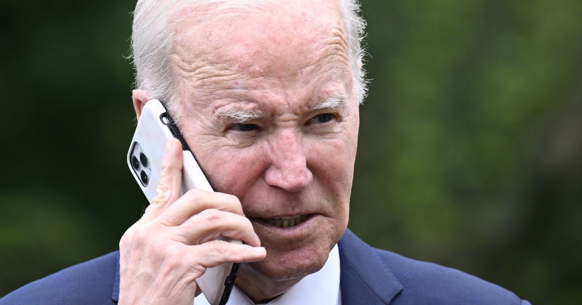 President Joe Biden speaks on the phone during a National Small Business Week event in the Rose Garden of the White House in Washington, D.C., on May 1.