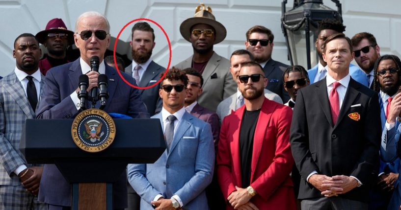 President Joe Biden stands at the forefront of a group photo with Kansas City Chiefs players. Harrison Buttker is circled in red in the back.