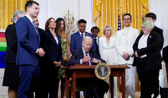 In a June 2022 file photo, President Joe Biden signs an executive order outlining federal measures to support gay, lesbians, bisexuals, transgenders and other sexual minorities.