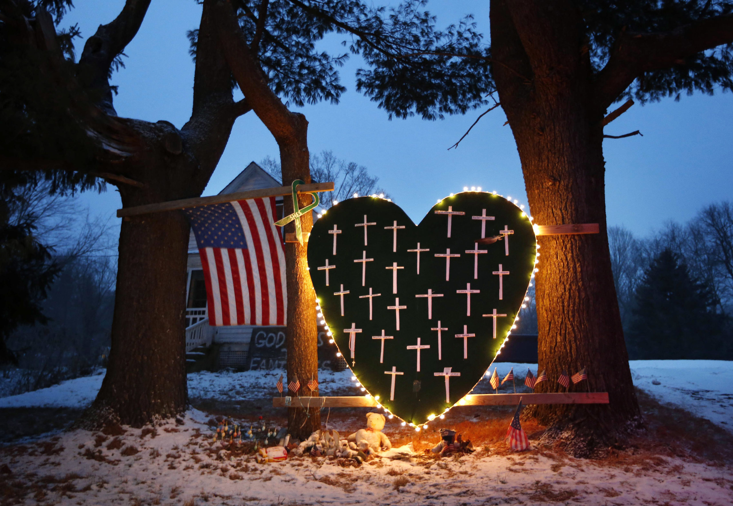 A makeshift memorial with crosses for the victims of the Sandy Hook Elementary School mass shooting stands outside a home on Dec. 14, 2013, on the first anniversary of the tragedy in Newtown, Connecticut. Twenty-six people died in the massacre.