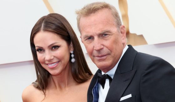 Christine Baumgartner and Kevin Costner attend the 94th Annual Academy Awards at Hollywood and Highland on March 27, 2022, in Hollywood, California.