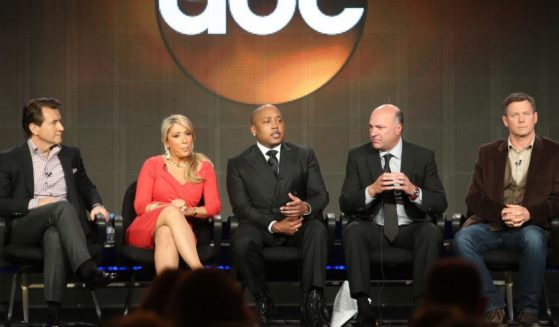 Daymond John, center, seen in a 2013 file photo, said he was forced to file a restraining order against former “Shark Tank” contestants.