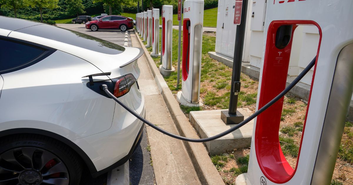 A Tesla electronic vehicle is charged at a Tesla charging station on May 25 in Nashville, Tennessee.