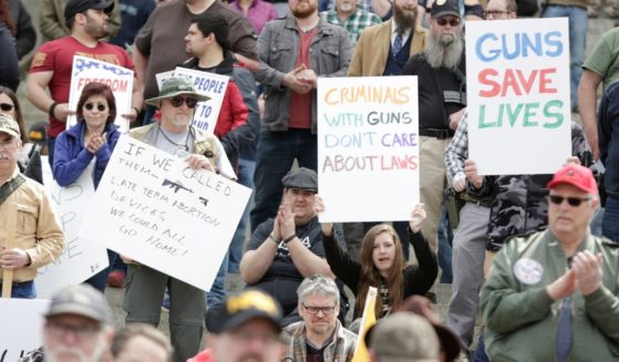 Gun advocates are pictured in front of the Washington state capitol during the "March for Our Rights" pro-gun rally in Olympia, Washington, on April 21, 2018.