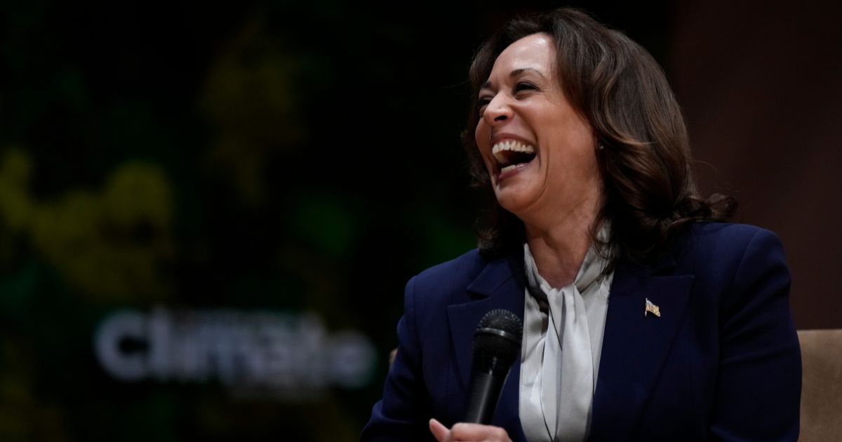 Vice President Kamala Harris laughs as she speaks with singer Gloria Estefan at the Aspen Ideas: Climate conference on March 8, in Miami Beach, Florida.
