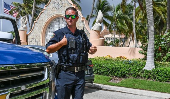Local law enforcement officers are seen in front of the home of former President Donald Trump at Mar-A-Lago in Palm Beach, Florida, on Aug. 9, 2022.