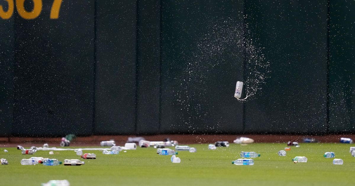 MLB fans stage ‘reverse boycott,’ toss garbage on field to message owner.