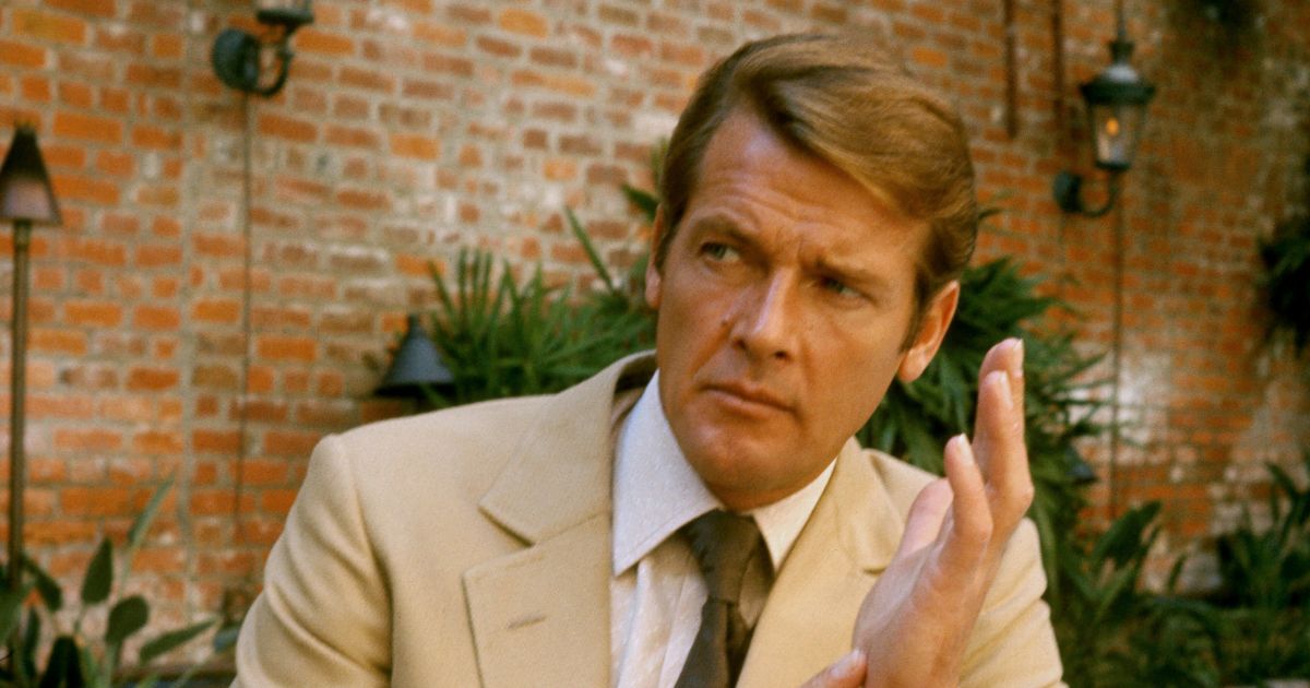 Roger Moore poses on location for the filming of James Bond film "Live And Let Die" on March 1, 1973, in Kingston, Jamaica.