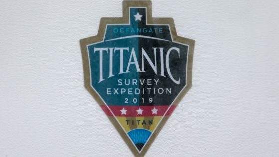 A decal which reads "Titanic Survey Expedition 2019 Titan" is pictured on a window at OceanGate at the Port of Everett Boat Yard in Everett, Washington, on June 20.