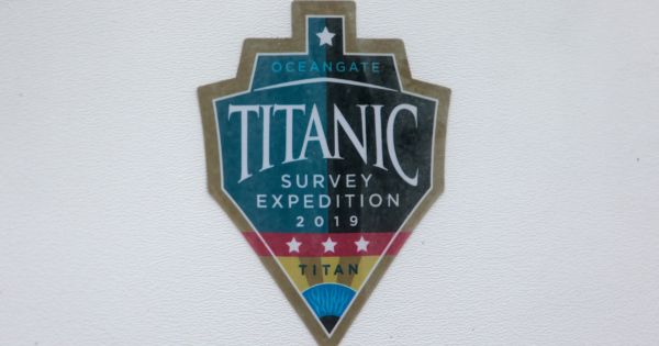 A decal which reads "Titanic Survey Expedition 2019 Titan" is pictured on a window at OceanGate at the Port of Everett Boat Yard in Everett, Washington, on June 20.