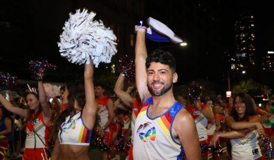 Members of the Sydney Swans Football Club and LA Rams cheerleaders walk in the Sydney Gay & Lesbian Mardi Gras Parade as part of Sydney WorldPride on February 25, 2023 in Sydney, Australia.