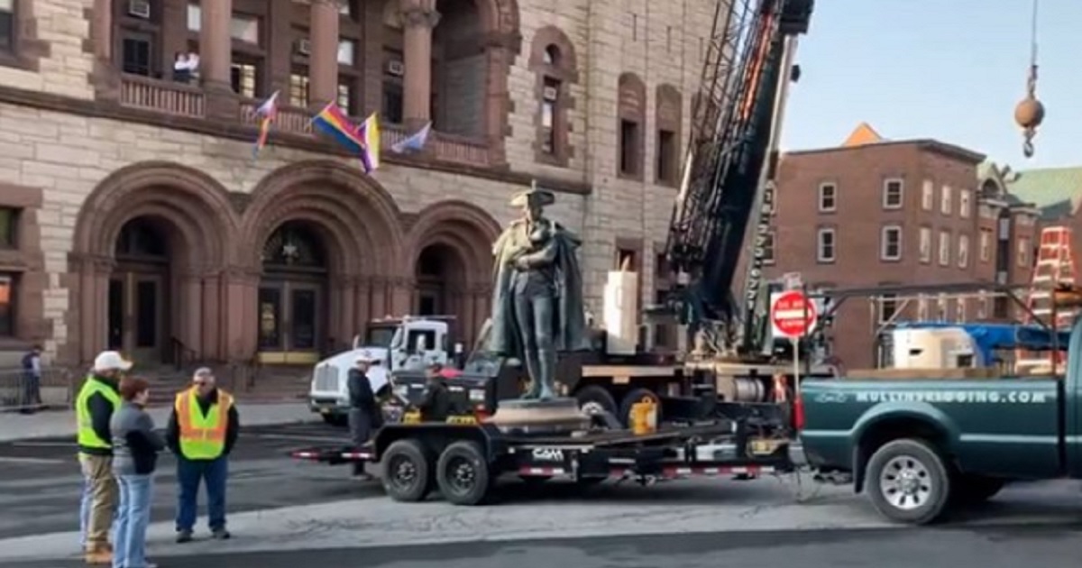A work crew removes a statue of Revolutionary War Gen. Philip Schuyler from the front of city hall in Albany, New York, on Saturday.