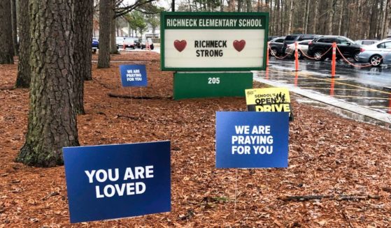 Signs stand outside Richneck Elementary School in Newport News, Virginia, on Jan. 25.