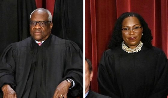 (L) Associate Justice Clarence Thomas and (R) Associate Justice Ketanji Brown Jackson their official photo at the Supreme Court in Washington, DC on October 7, 2022.