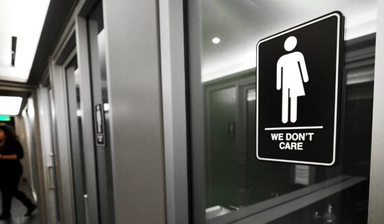 'Gender neutral' signs are posted in the 21C Museum Hotel public restrooms on May 10, 2016 in Durham, North Carolina.