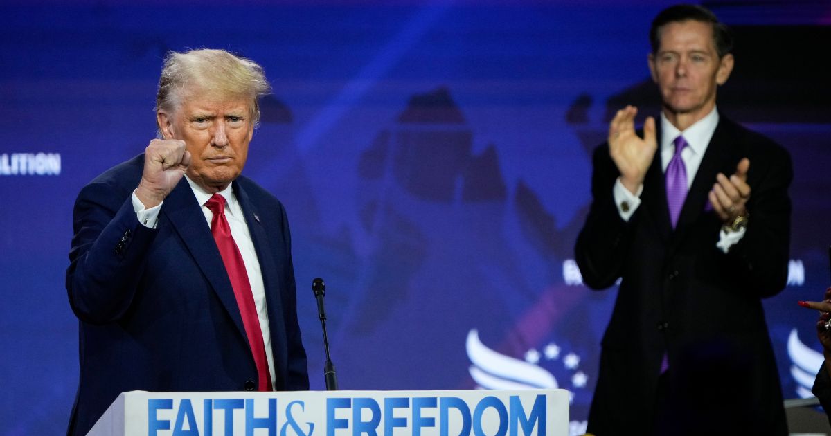 Republican presidential candidate former President Donald Trump concludes his remarks as Chairman of the Faith and Freedom Coalition Ralph Reed applauds at the Faith and Freedom Road to Majority conference at the Washington Hilton on Saturday in Washington, D.C.