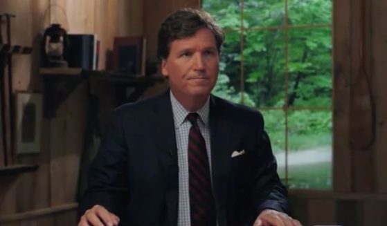 Tucker Carlson is seen at his news desk for his new show “Tucker on Twitter” in a Tuesday episode.