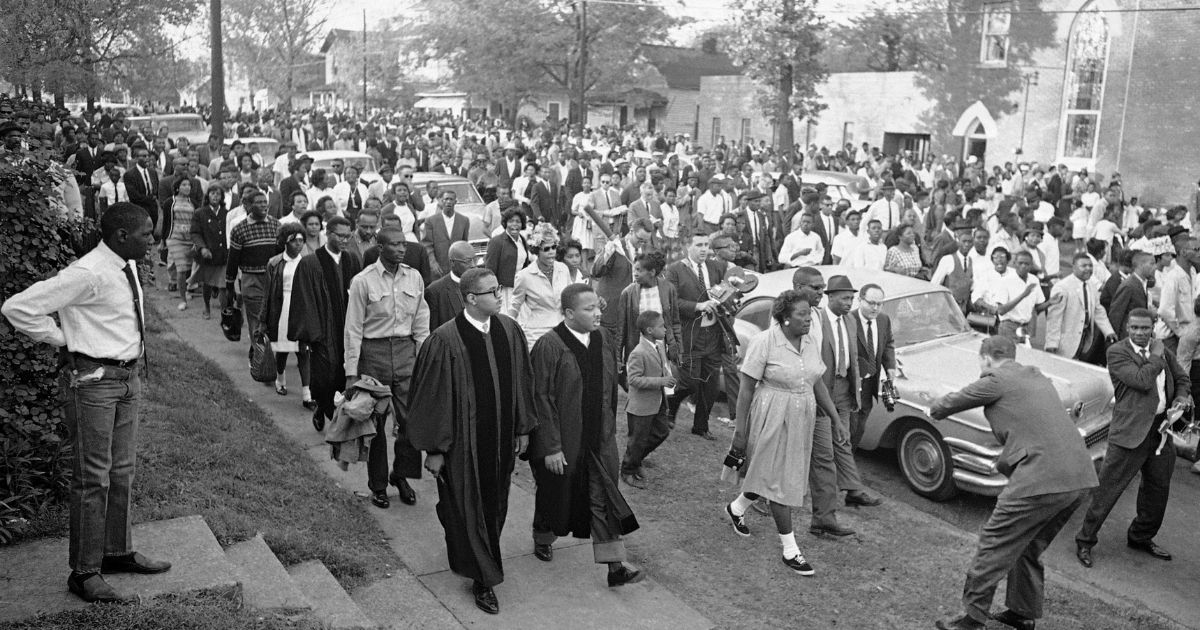 In this April 14, 1963 file photo, two ministers lead protest marchers in a civil rights demonstration in Birmingham, Ala., which was later broken up by police.