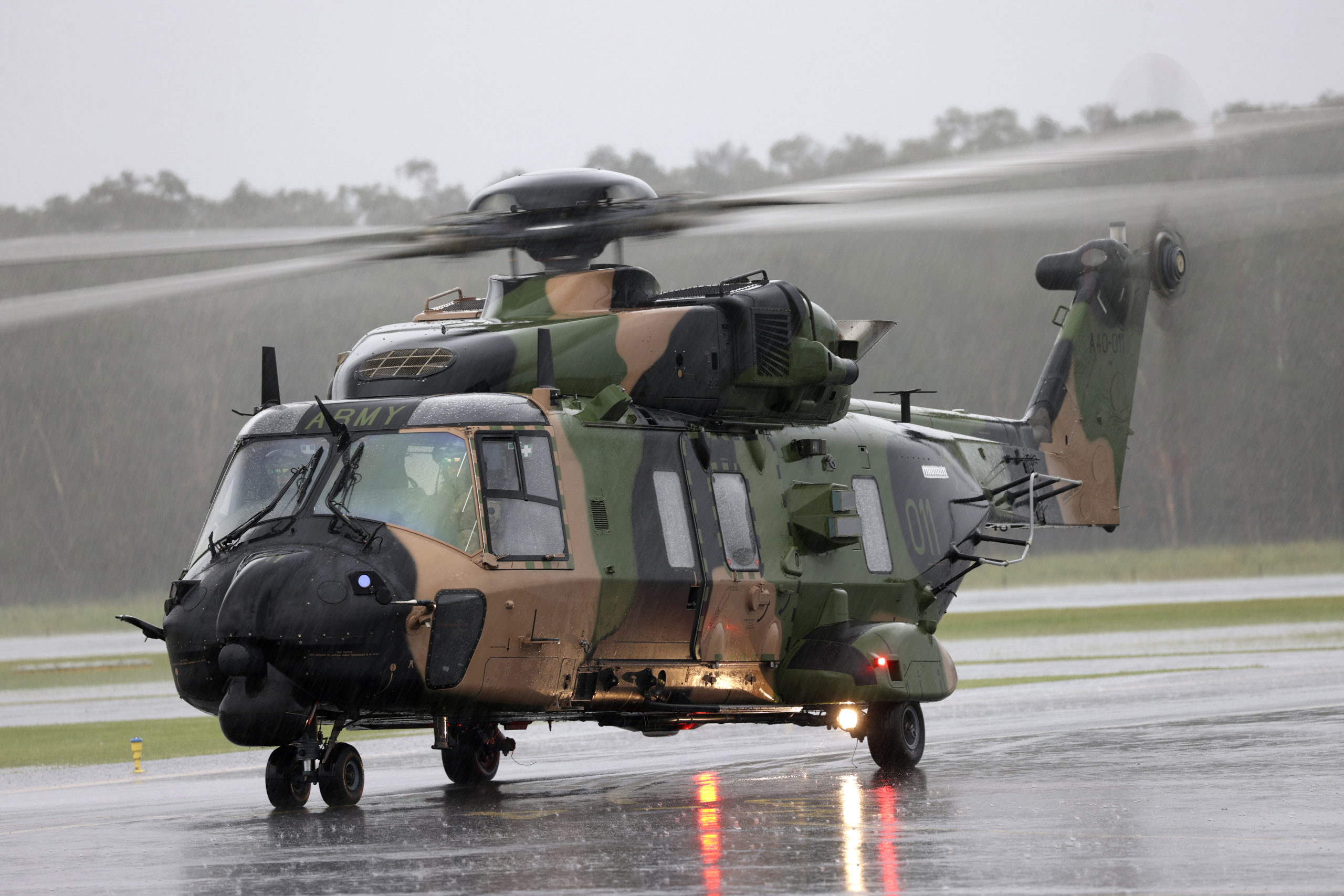 In this photo provided by the Australian Defence Force, an Australian Army MRH-90 Taipan helicopter prepares to take off from the airport in Ballina, Australia, on Feb. 27, 2022.