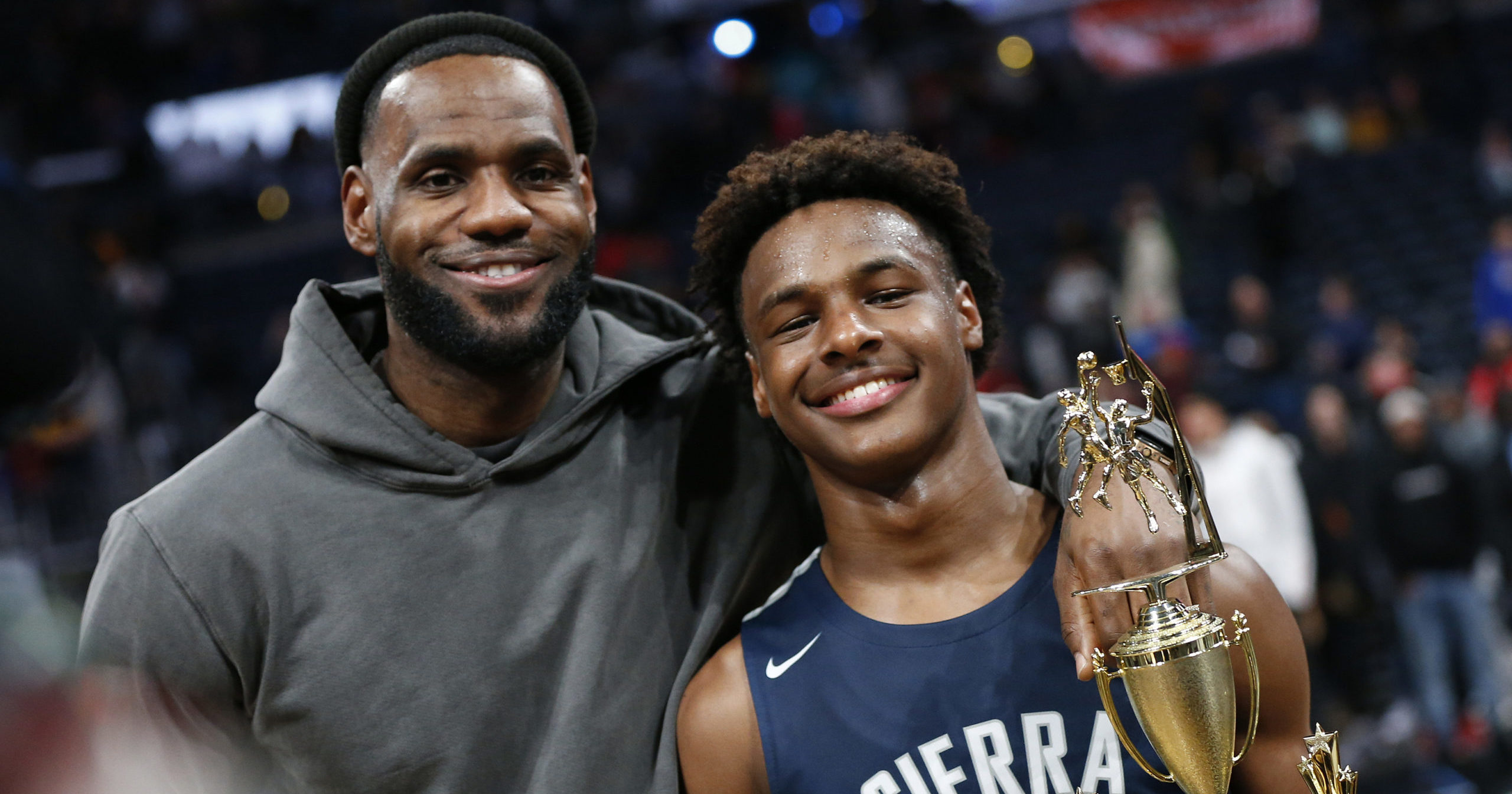 LeBron James, left, poses with his son Bronny after Sierra Canyon beat Akron St. Vincent-St. Mary in a high school basketball game on Dec. 14, 2019, in Columbus, Ohio.