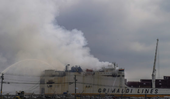 Emergency personnel battle a fire aboard the Italian-flagged Grande Costa d'Avorio cargo ship at the Port of Newark in New Jersey on Friday.