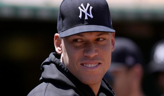 Aaron Judge of the New York Yankees looks on from the dugout during a game against the Oakland Athletics at RingCentral Coliseum on June 29 in Oakland, California.