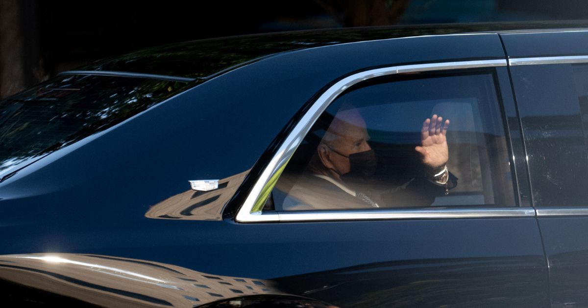 President Joe Biden waves from the motorcade after departing the annual 9/11 Commemoration Ceremony at the National 9/11 Memorial and Museum in New York City, on September 11, 2021.