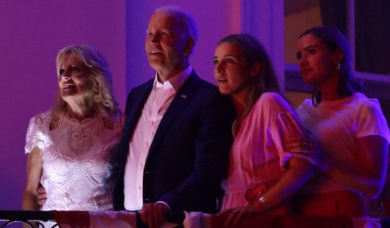First lady Jill Biden, left, President Joe Biden, middle left, and their granddaughters, Finnegan Biden and Naomi Biden, watch fireworks from the White House on Tuesday.