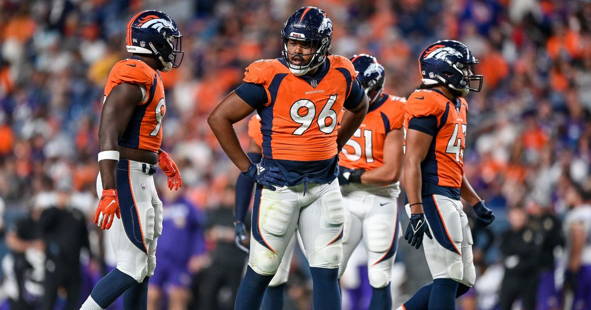 Broncos defensive end Eyioma Uwazurike (No. 96) talks to his teammates during a preseason game against the Minnesota Vikings at Empower Field at Mile High in Denver on Aug. 27, 2022.