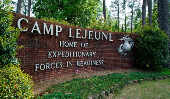 A sign for Camp Lejeune is displayed outside the main gate to Camp Lejeune Marine Base near Jacksonville, North Carolina.
