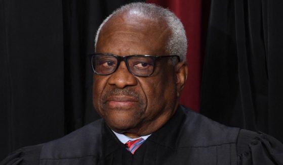 Associate Supreme Court Justice Clarence Thomas poses for the official photo at the Supreme Court in Washington, D.C., on Oct. 7, 2022.
