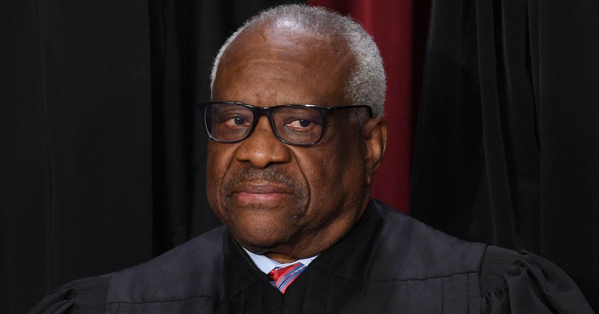 Associate Supreme Court Justice Clarence Thomas poses for the official photo at the Supreme Court in Washington, D.C., on Oct. 7, 2022.