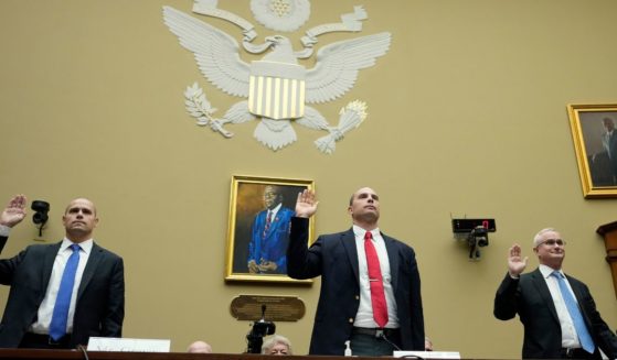 Ryan Graves, David Grusch and retired Navy Cmdr. David Fravor are sworn in during a House Oversight Committee hearing on Capitol Hill on Wednesday in Washington, D.C.