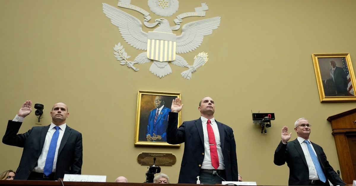 Ryan Graves, David Grusch and retired Navy Cmdr. David Fravor are sworn in during a House Oversight Committee hearing on Capitol Hill on Wednesday in Washington, D.C.