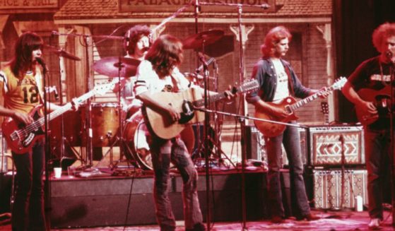 Randy Meisner, left, and the Eagles perform on stage before a faux Old West backdrop in 1974. Other members of the band are, from left, drummer Don Henley, guitarist Glenn Frey, guitarist Don Felder and guitarist Bernie Leadon.
