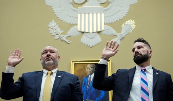 Gary Shapley, left, and Joseph Ziegler are sworn in during a House Oversight Committee hearing related to the Justice Department's investigation of Hunter Biden on July 19 in Washington, D.C.