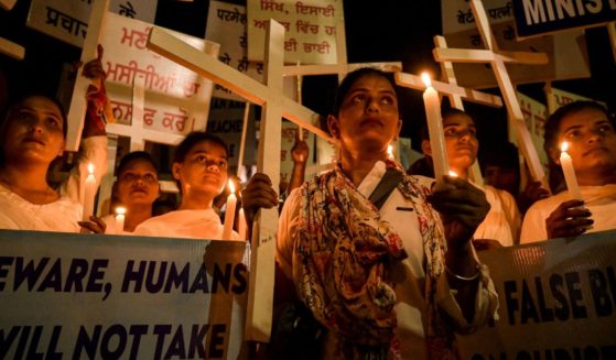 Christians take part in a candlelight vigil in protest of sexual violence against women and the ongoing ethnic violence in India's northeastern state of Manipur on Thursday.