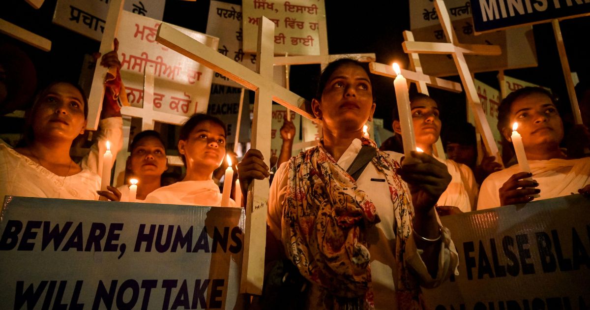 Christians take part in a candlelight vigil in protest of sexual violence against women and the ongoing ethnic violence in India's northeastern state of Manipur on Thursday.